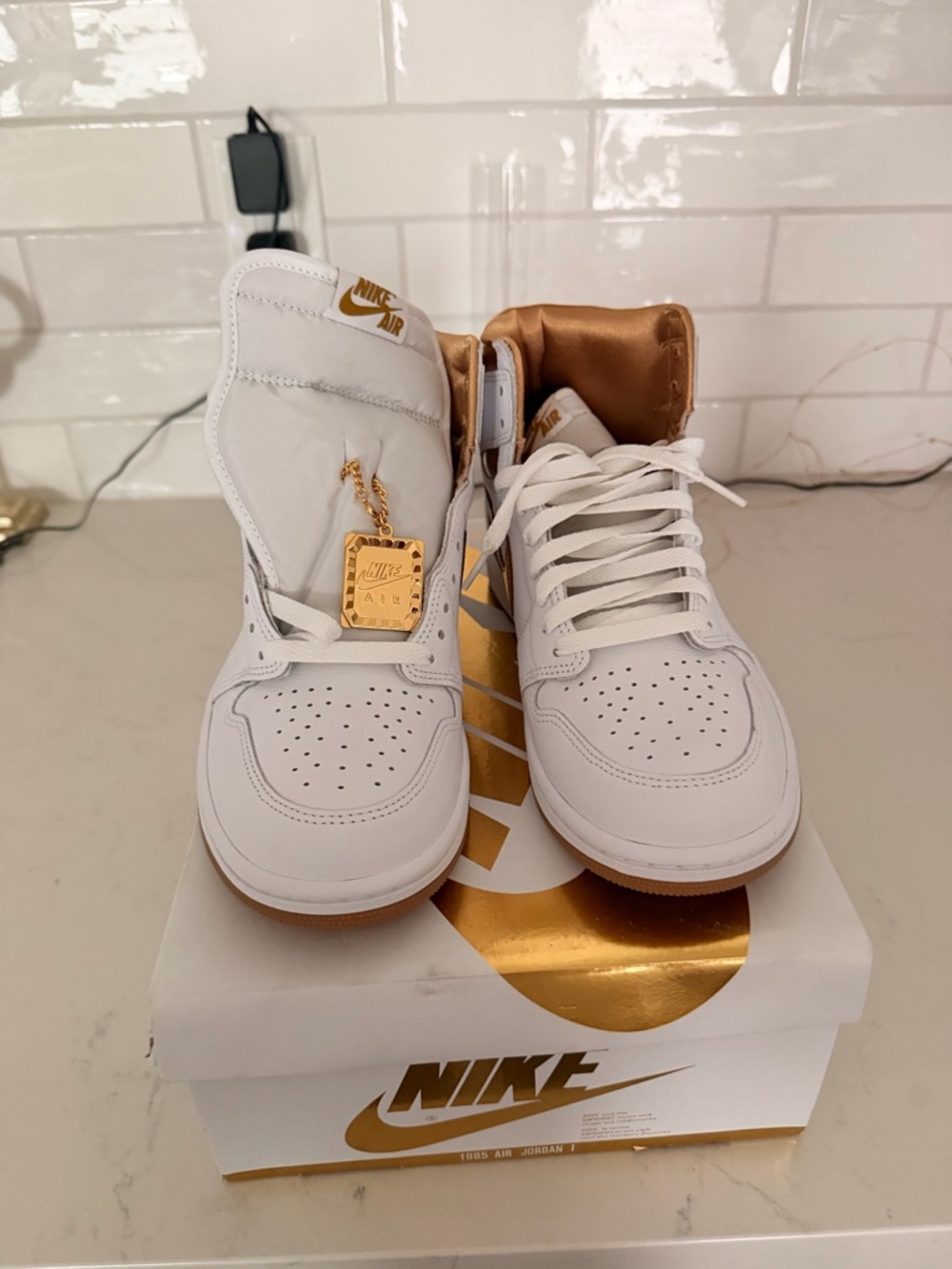 Nike White and Gold Air Jordan 1 High Top Sneakers